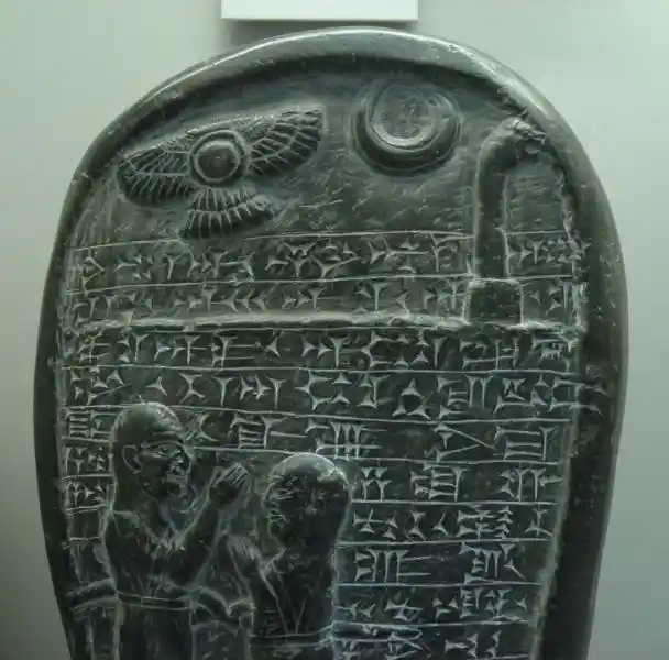 Winged disc and a crescent on a stone Winged disc and a crescent on a stone